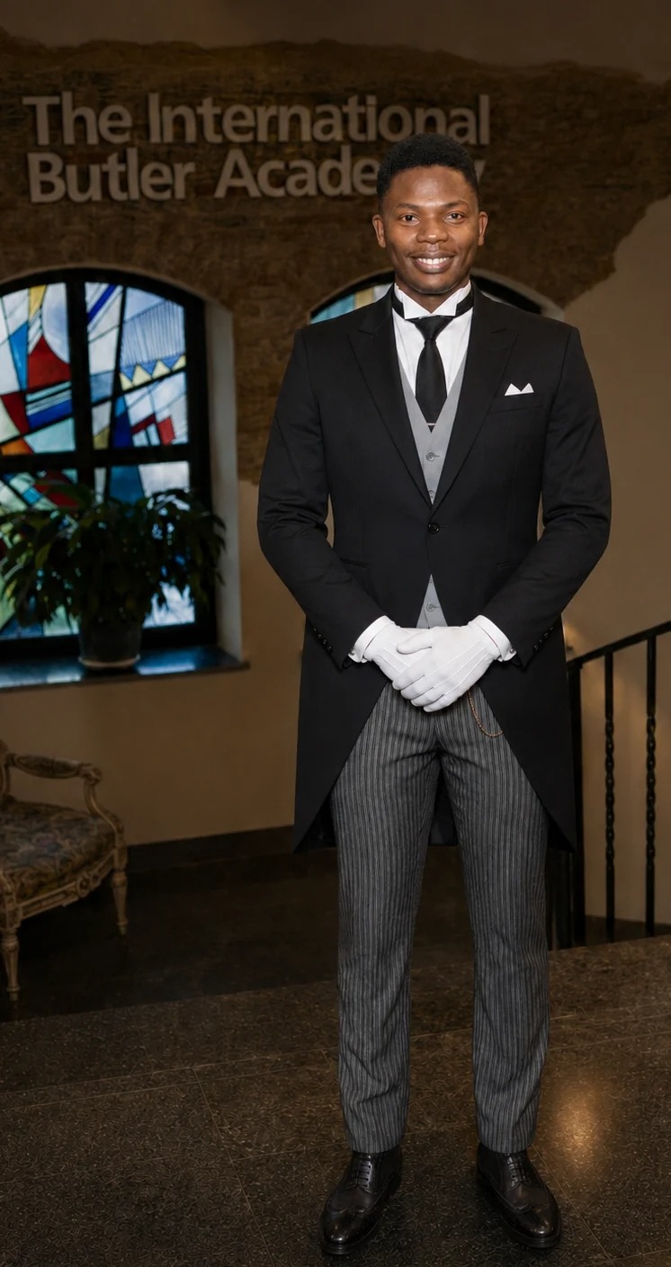 MJ LIRU in formal butler uniform at The International Butler Academy